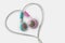 Blue and pink earphones in heart shape on white background - Concept of love and communication between men and women gender