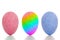 Blue, pink and rainbow painted eggs, standing upright, on white background with shadow. Gender studies etc.