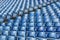 Blue plastic chairs with numbers on the tribune.