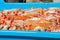 Blue plastic containers with catch of sea shrimps