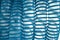 Blue plastic corrugated hose with water drops inside.