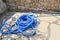 Blue plastic long large corrugated hose for cleaning the pool wash and watering the plants