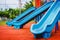 Blue plastic playground slider