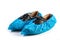Blue plastic protective shoe covers on black shoes