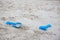 Blue plastic sand construction toy isolated on sand beach