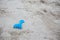 Blue plastic sand construction toy on sand beach