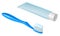 Blue plastic toothbrush with toothpaste and tube of toothpaste with white cap
