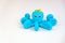 Blue plasticine octopus on white background, children`s games with modeling clay