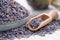 Blue plate of dried lavender. Wooden scoop of dry lavender flowers close up