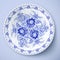 Blue plate with floral ornament in gzhel style