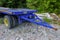 Blue platform trailer truck close-up. Transportation equipment. Logistics element. Heavy machinery