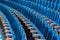 Blue plush chairs with wooden armrests in the auditorium. Empty auditorium in the theater