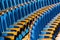 Blue plush chairs with wooden armrests in the auditorium. Empty auditorium in the theater