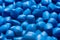 Blue polymer dye in granules, background texture