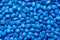 Blue polymer dye in granules, background texture