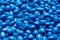 Blue polymer dye in granules, background texture