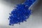 Blue polymer granules in test glass