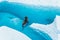 Blue pool and narrow seracs fins of ice on top of the Matanuska Glacier in the Alaskan backcountry