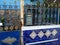 Blue post box on railings along Selaron Steps in Rio de Janeiro, Brazil.