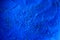 Blue powder texture close up. Cloth whitener indigo