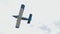 Blue propeller bi plane jet flying sky airshow. Biplane fly air show slow motion