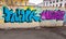 Blue and purple chaotic graffiti text patterns