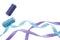 Blue and purple curly satin ribbons, spools of blue and purple thread on a white. Horizontal banner with two satin ribbons and