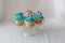 Blue and Purple frosted cupcakes decorated with gold dust