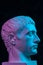 Blue purple gypsum copy of ancient statue of Germanicus Julius Caesar head for artists isolated on black background