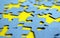 Blue puzzles scattered on a yellow background
