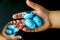 Blue quail eggs and hands