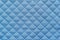 Blue quilted synthetic fabric with grained texture