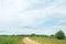 Blue rainy clouds over country road