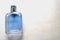 Blue rectangular beautiful glass transparent shiny fashionable glamorous bottle of cologne, perfume with silvery bezel and place f