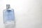 Blue rectangular beautiful glass transparent shiny fashionable glamorous bottle of cologne, perfume with silvery bezel and place f