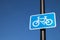 Blue rectangular cycle path route sign on metal pole