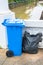 The blue recycle garbage can and garbage bag