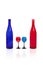 Blue and red bottle with glasses of the same color.