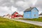 Blue, red and white norwegian houses along the road in Andenes village, Andoy Municipality, Vesteralen district, Nordland county,