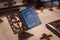 Blue religious book near cross in church