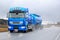 Blue Renault Premium 460 Tank Truck in Rainy Conditions