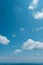 Blue Ridge Mountains of North Carolina, USA looking tiny and distant under deep blue sky with puffy white clouds