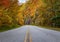 Blue Ridge Parkway cuts right through the colorful trees surrounding the road