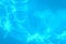 Blue ripped water in swimming pool . texture pool . Shining blue water ripple background