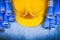 Blue rolled engineering drawings yellow building helmet on metal