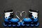 Blue roller skates and heart from laces on dark chalk board background. Valentine`s day