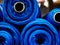 Blue rolls of knitted fabric. Classic blue color