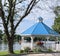 Blue roofed, White Gazebo on Bank of Trent River in Hastings, Ontario