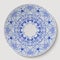 Blue round floral ornament applied to the ceramic plate.