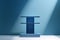 A blue round podium sits on a stage with a blue background